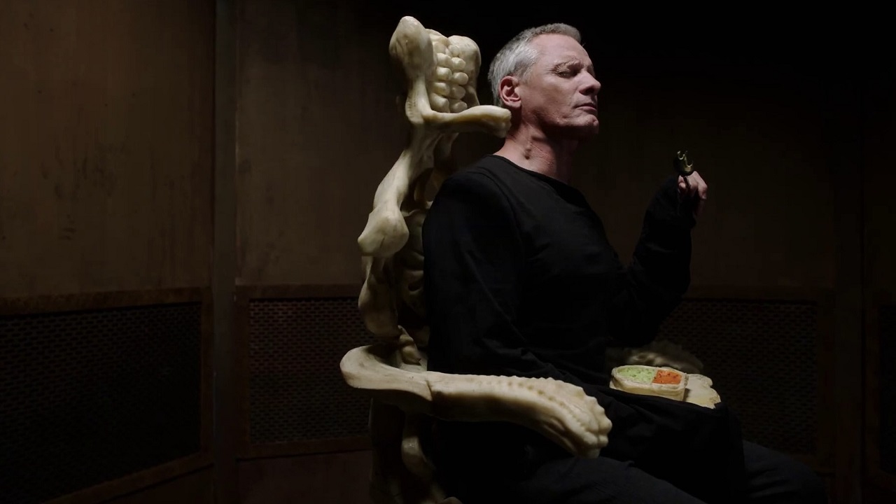 Viggo Mortensen in skeletal chair in Crimes of the Future (2022)