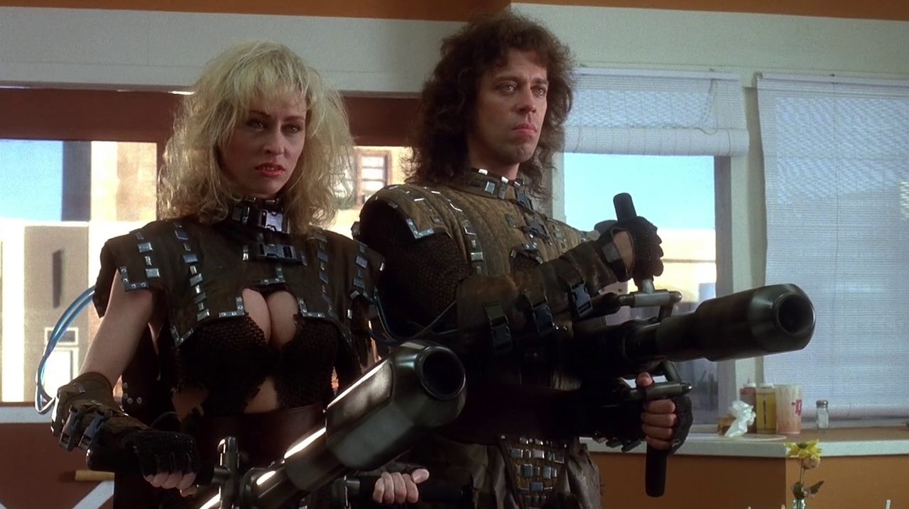 The return of intergalactic bounty hunters Ug (Terrence Mann) and Lee (Roxanne Kernohan) in Critters 2 (1988)