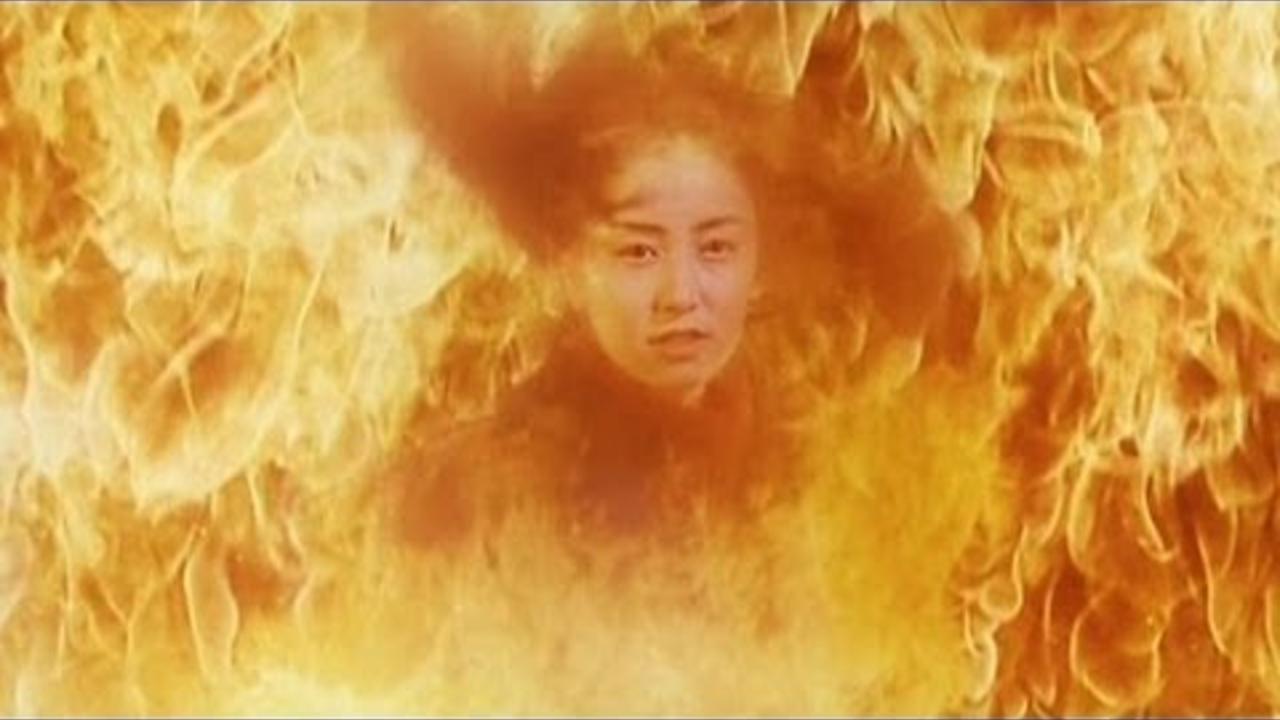 Akiko Yada erupts into flames in Cross Fire (2000)