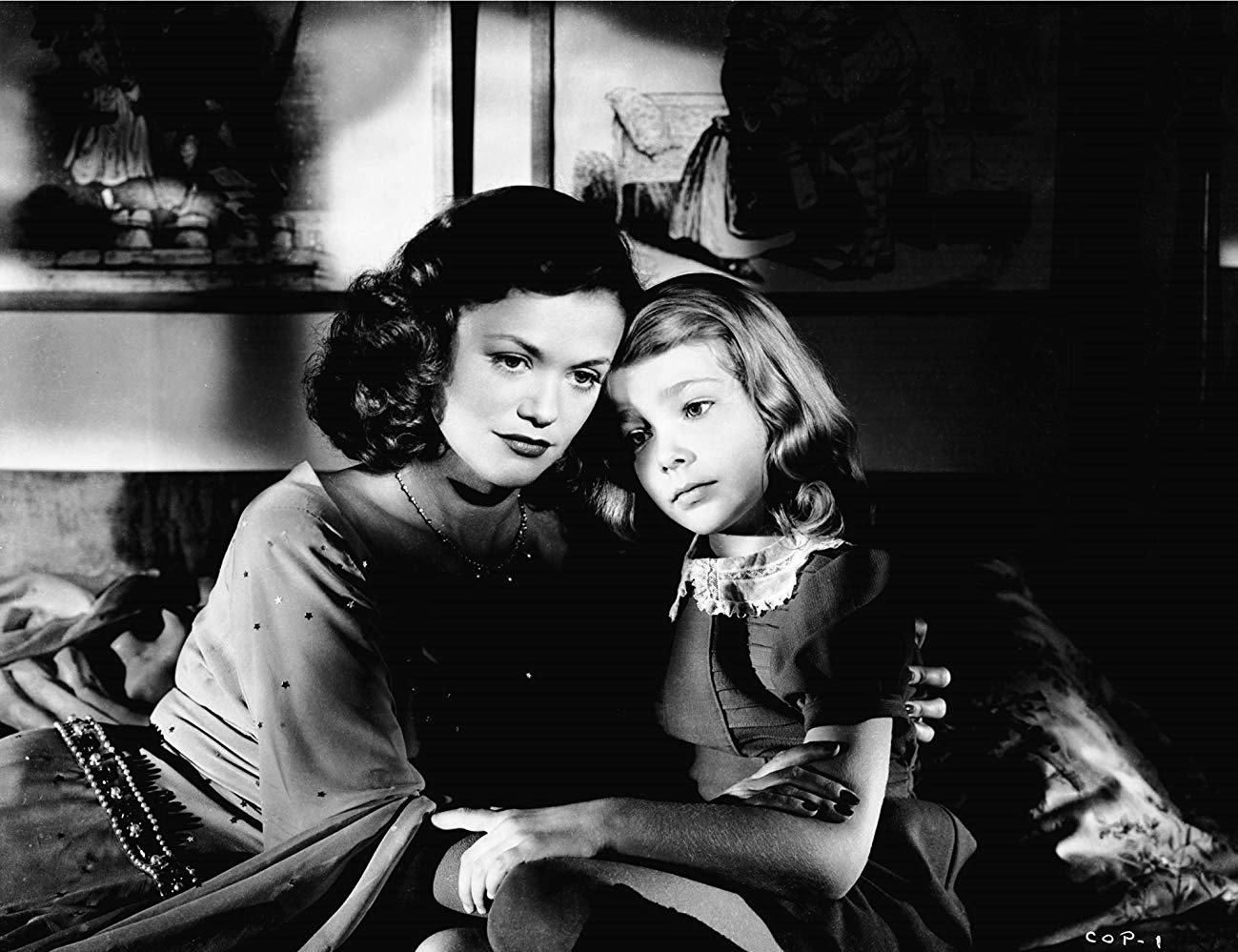 Simone Simon comforts young Ann Carter in The Curse of the Cat People (1944)