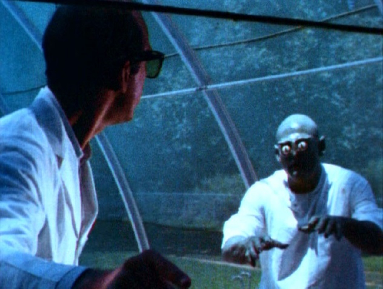 Mad scientist Jeff Alexander and the swamp creature (Bill Thurman) in Curse of the Swamp Creature (1966)