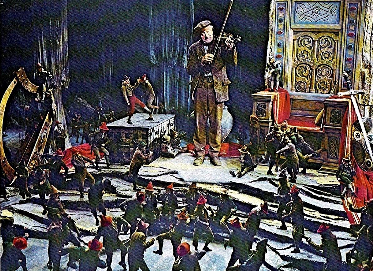 Darby O'Gill (Albert Sharpe) plays fiddle in the kingdom of the leprechauns in Darby O'Gill and the Little People (1959)