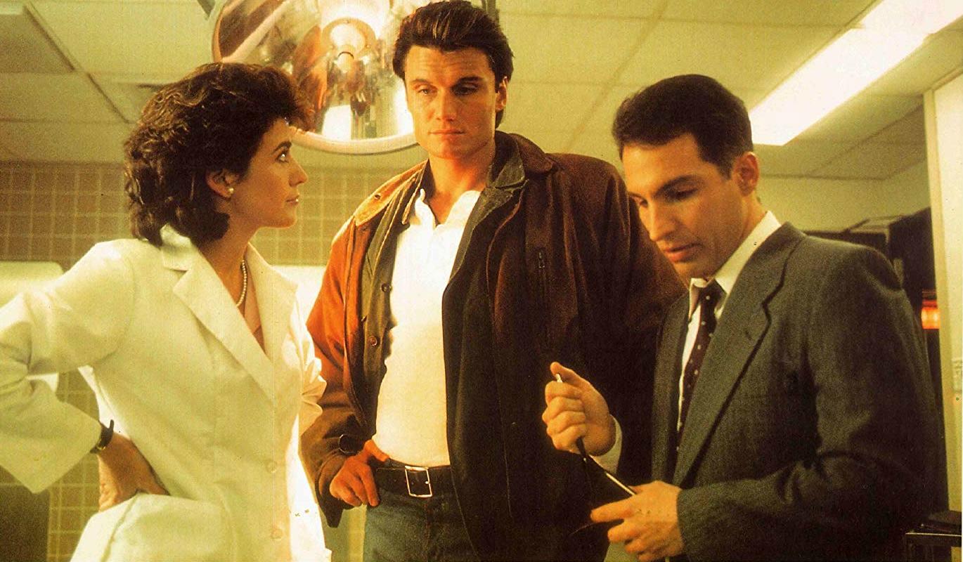 (l to r) Coroner Betsy Brantley and buddy cops Dolph Lundgren and FBI agent Brian Benben in Dark Angel (1990)