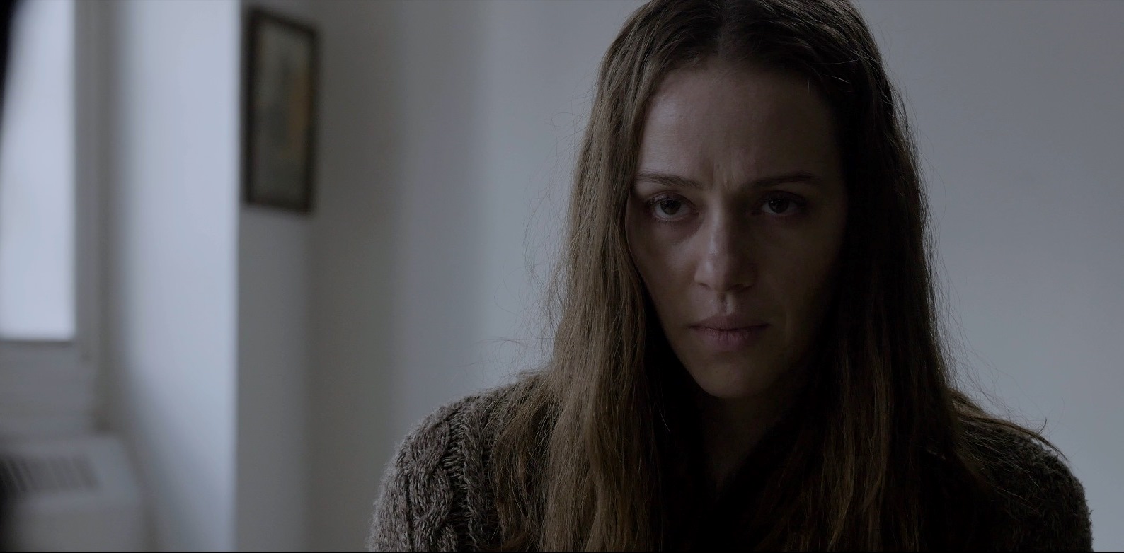 Asylum inmate Sybil (April Billingsley) in The Dark Red (2019)