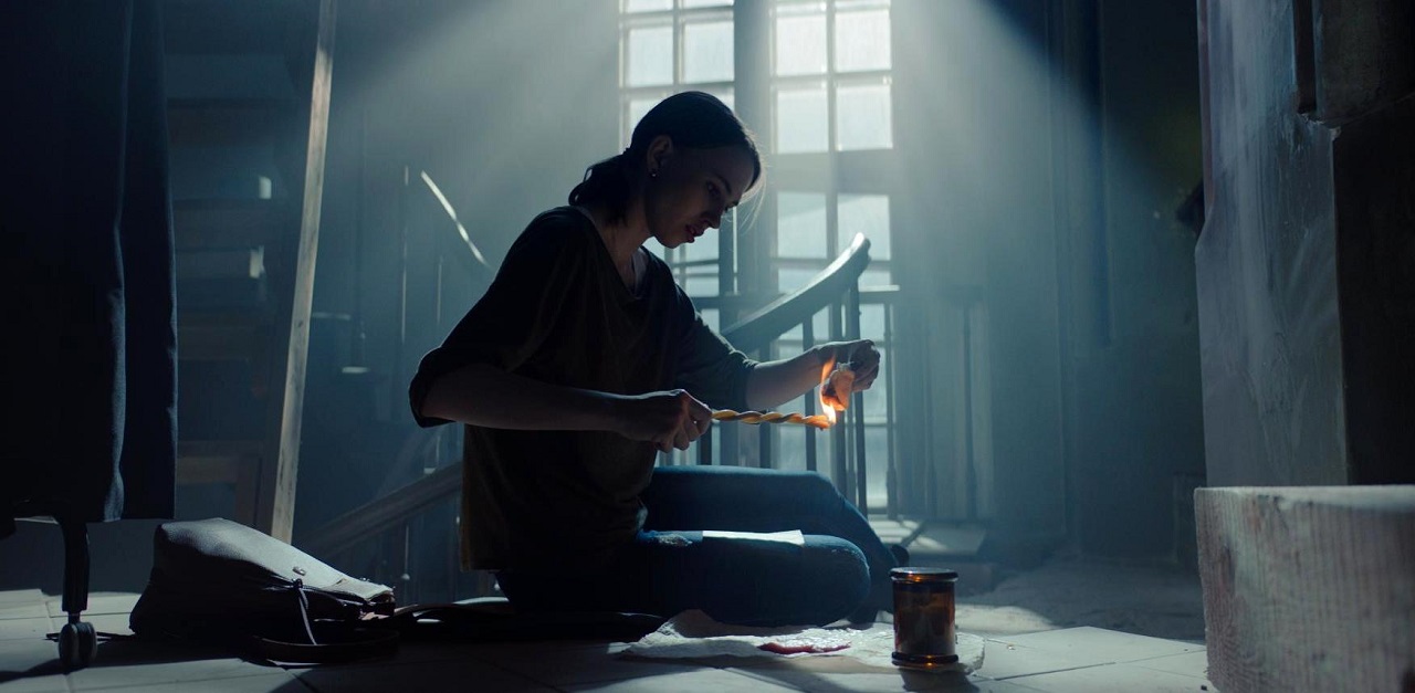 Zhenya (Yana Enzhaeva) conducts her love spell in Dark Spell (2021)