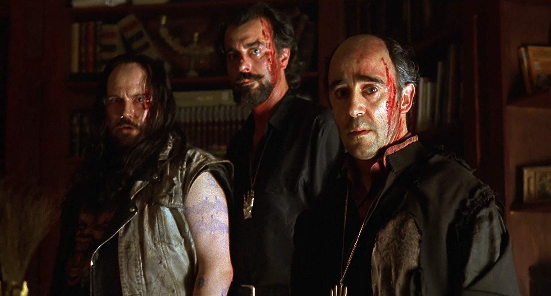 (l to r) Santiago Segura, Armando De Razza and priest Alex Angulo prepare to summon The Devil in The Day of the Beast (1995)