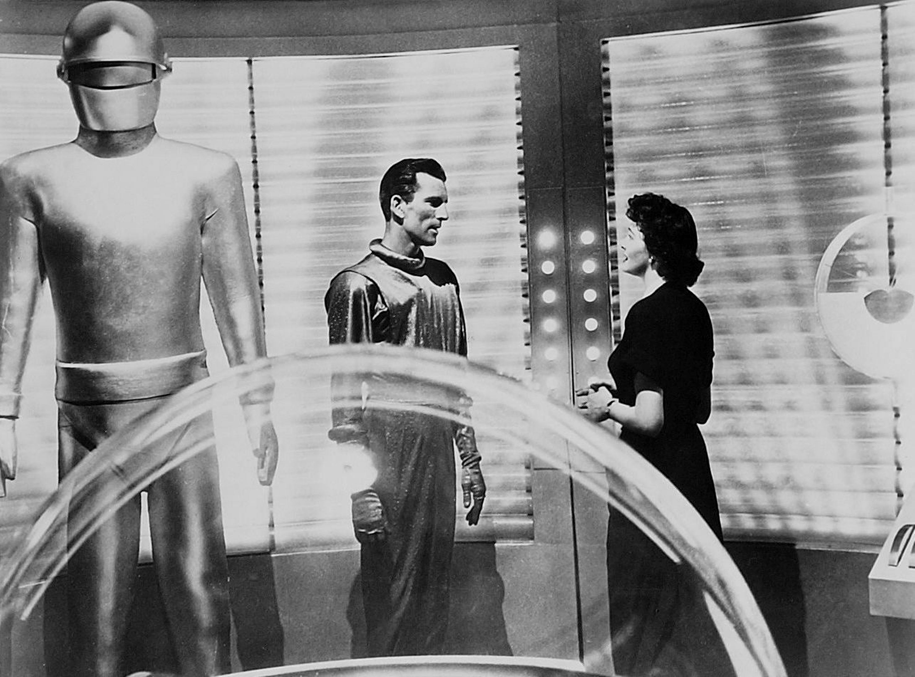 Gort (Lock Martin), Klaatu (Michael Rennie) and Helen Benson (Patricia Neal) inside the saucer in The Day the Earth Stood Still (1951)