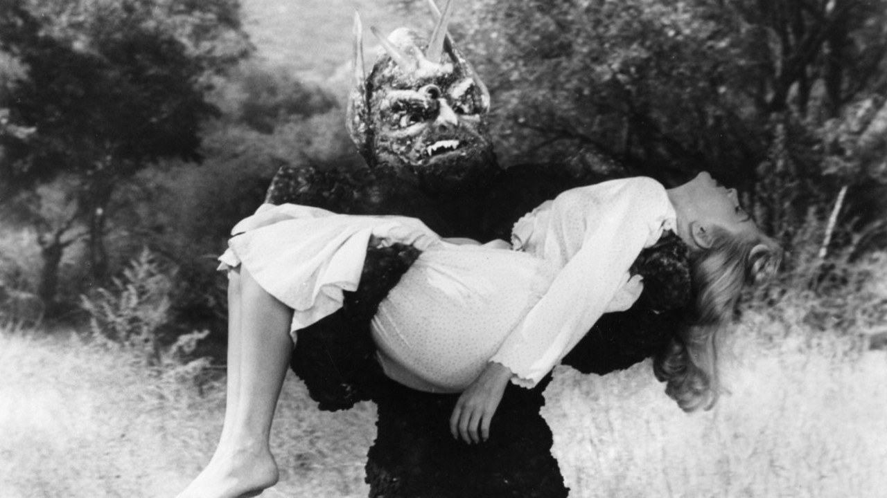 The mutant monster (Paul Blaisdell) abducts Lori Nelson in Day the World Ended (1955)
