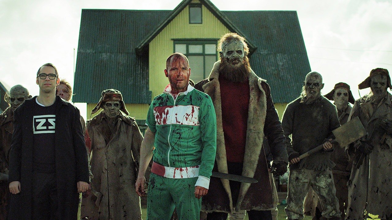 The local defenders - (l to r front) Daniel (Martin Starr) from the Zombie Squad, returning hero Vegar Hoel and Derek Mears (with beard) as the Soviet commander Lieutenant Stavarin and assorted Soviet zombies in Dead Snow 2 (2014)