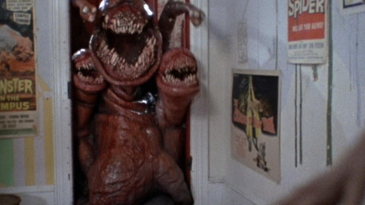 The alien creature invades a bedroom in The Deadly Spawn (1982)