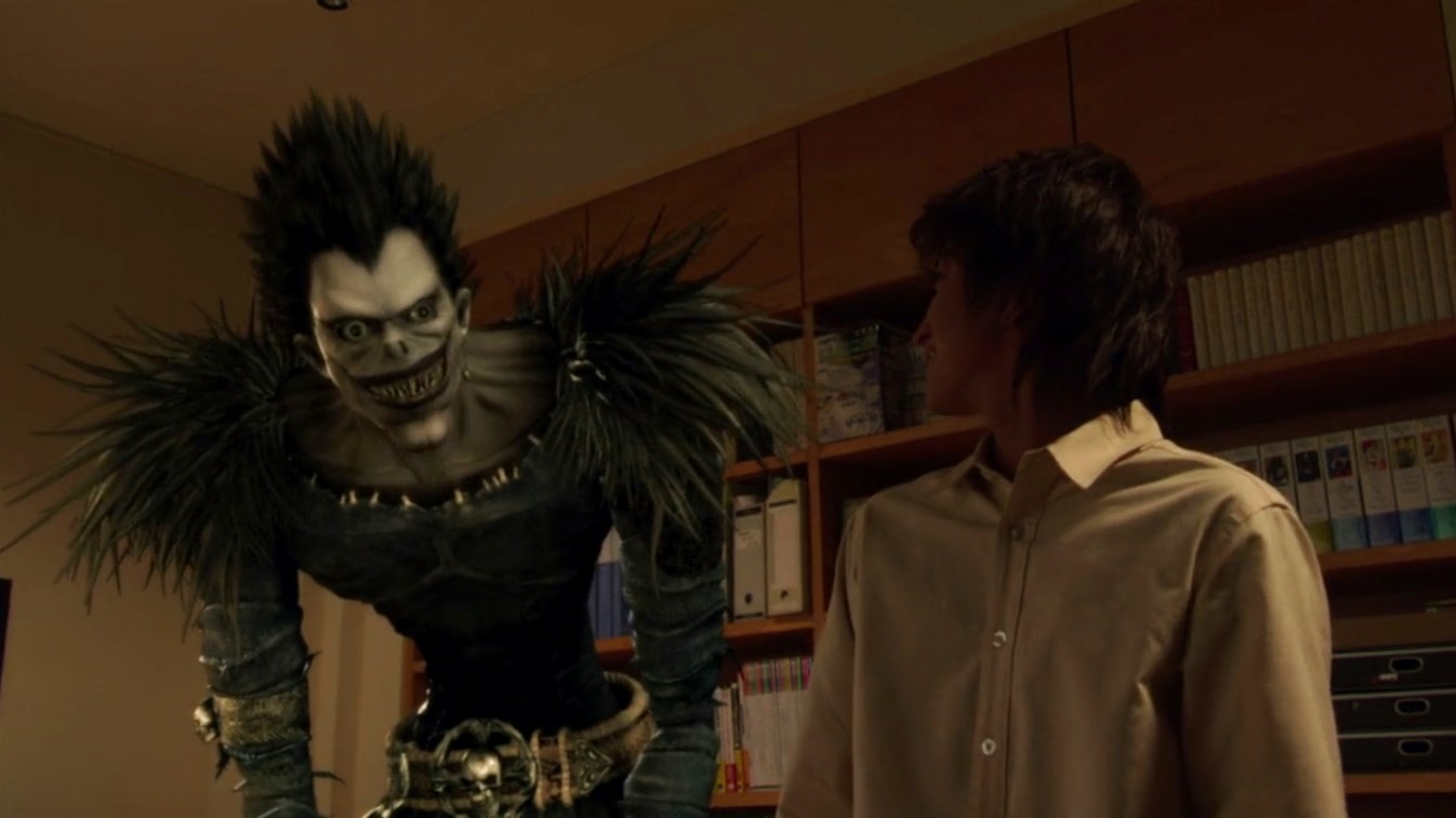 Light Turner (Nat Wolff) and the death god Ryuk in Death Note (2017)