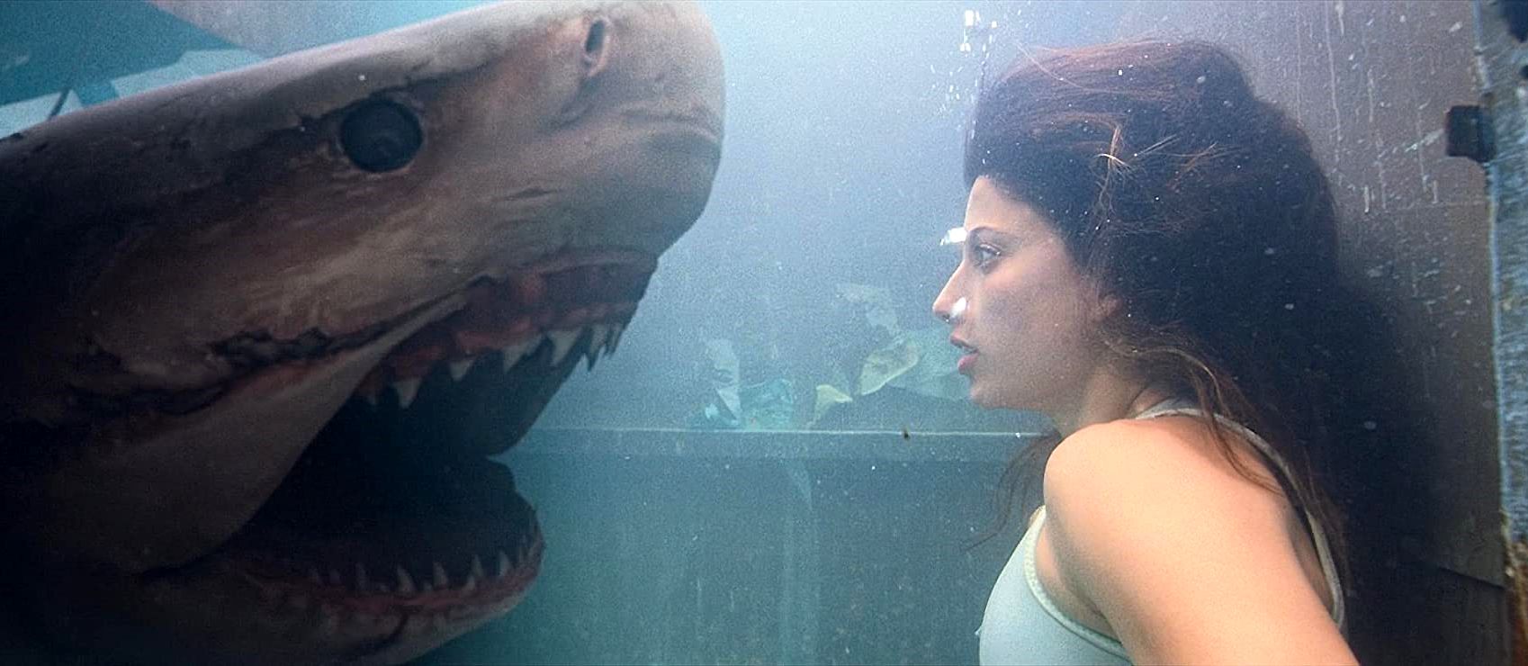 Tania Raymonde faces a shark while trapped inside a garbage compactor in Deep Blue Sea 3 (2020)