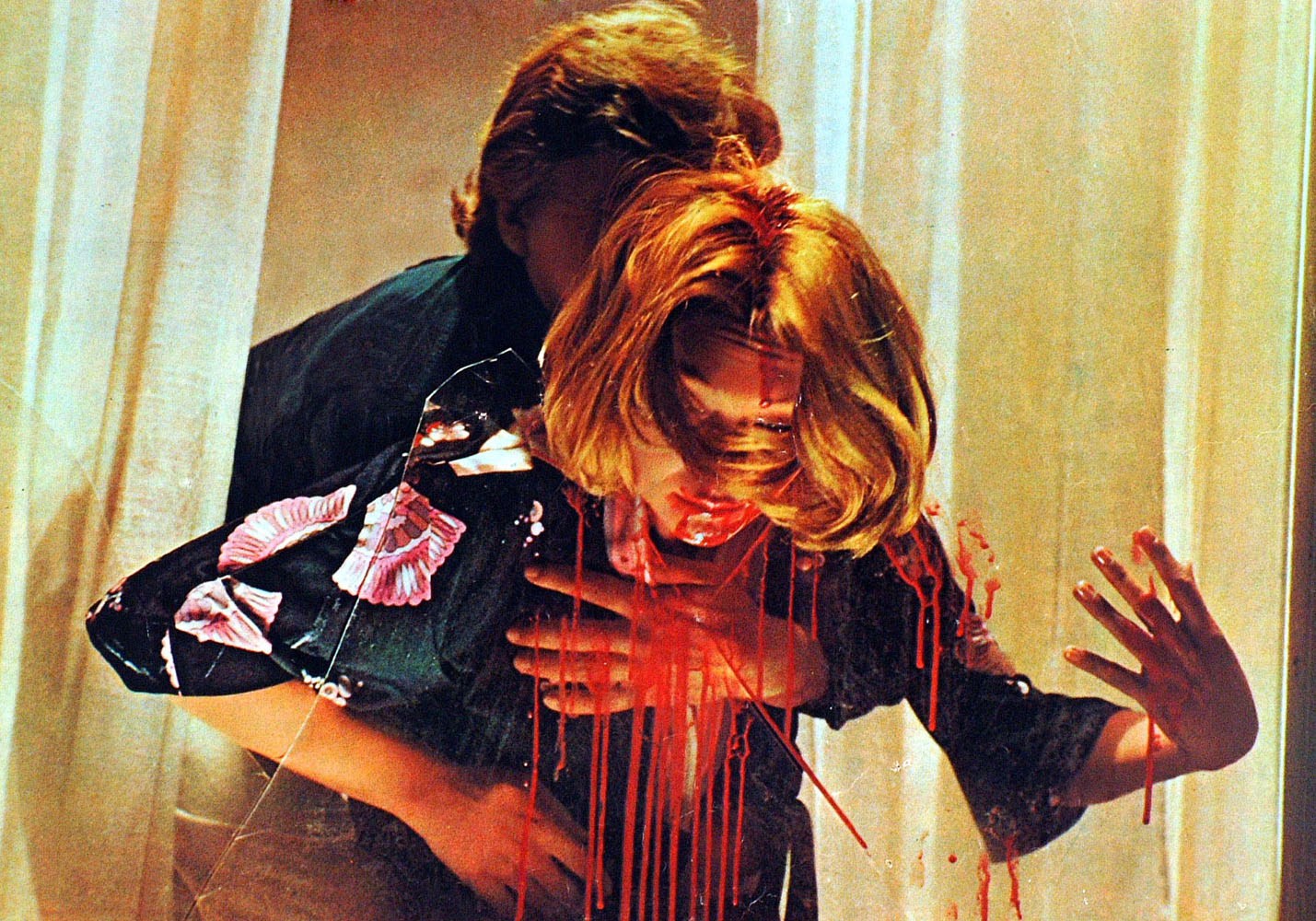 Psychic Macha Meril impaled on the glass of a broken window in Deep Red (1976)