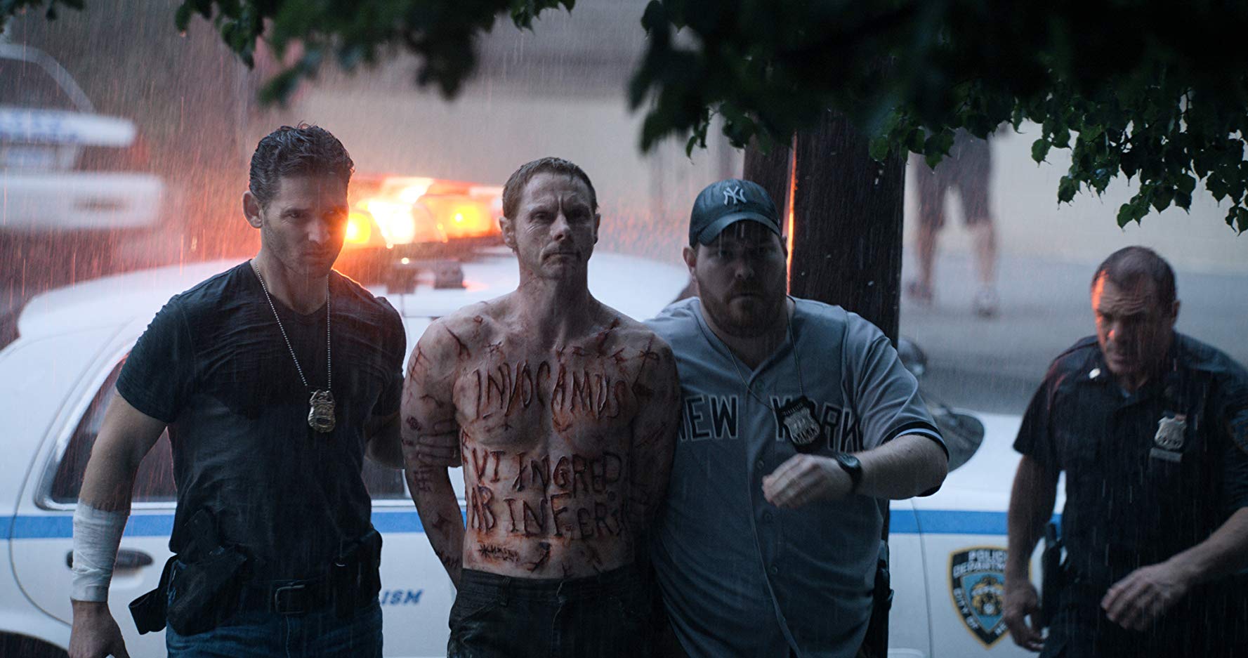 (l to r) Ralph Sarchie (Eric Bana) arrests the possessed Mick Santino (Sean Harris) in Deliver Us From Evil (2014)