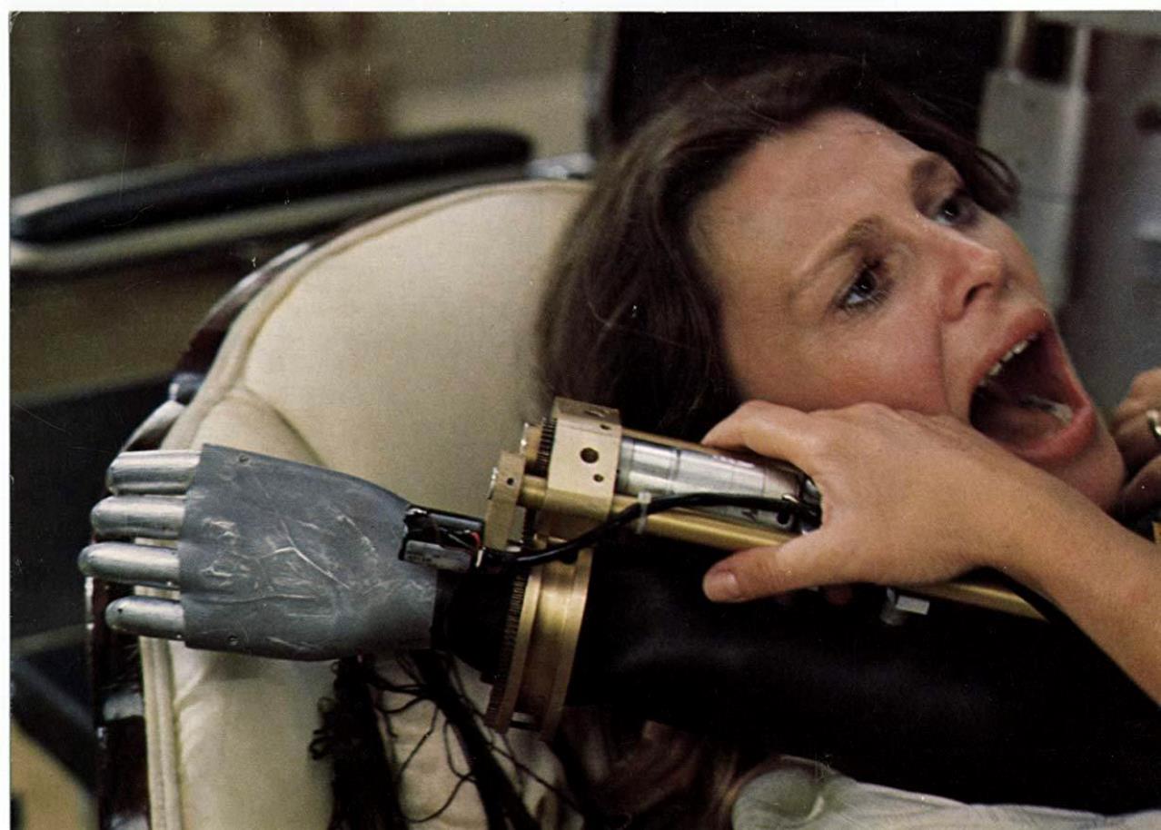 Julie Christie held prisoner by the robotic arm of a computer-controlled wheelchair in Demon Seed (1977)