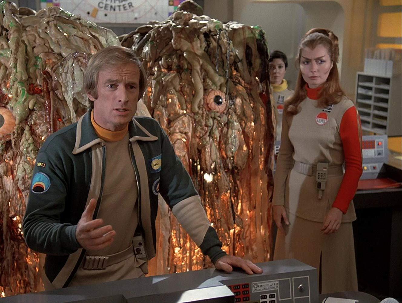 Alan Carter (Nick Tate), Sandra Benes (Zienia Merton) and Maya (Catherine Schell) surrounded by the aliens in Destination Moonbase-Alpha (1979)