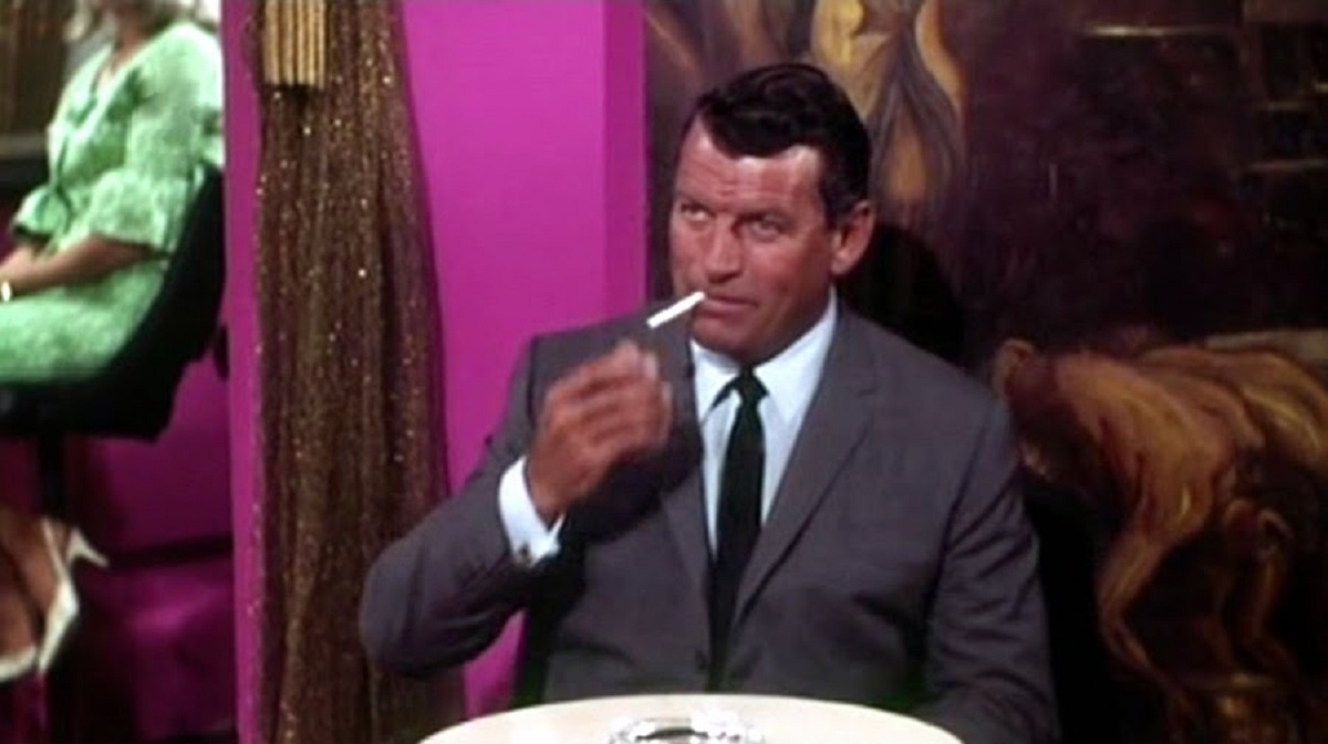 Richard Egan as payboy Dan Street in The Destructors (1968)