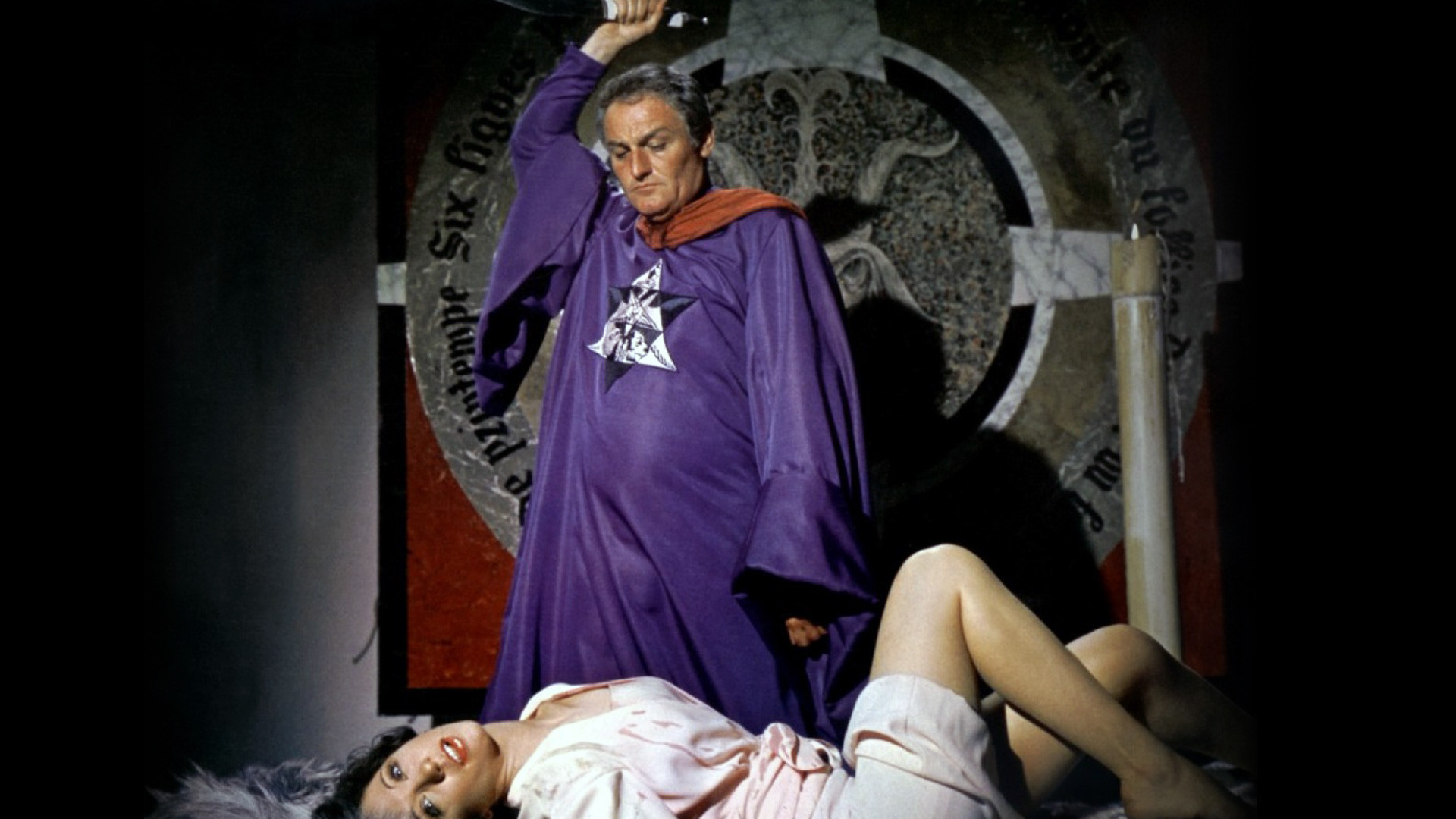 Mocata (Charles Gray) prepares to sacrifice Niké Arrighi in The Devil Rides Out (1968)