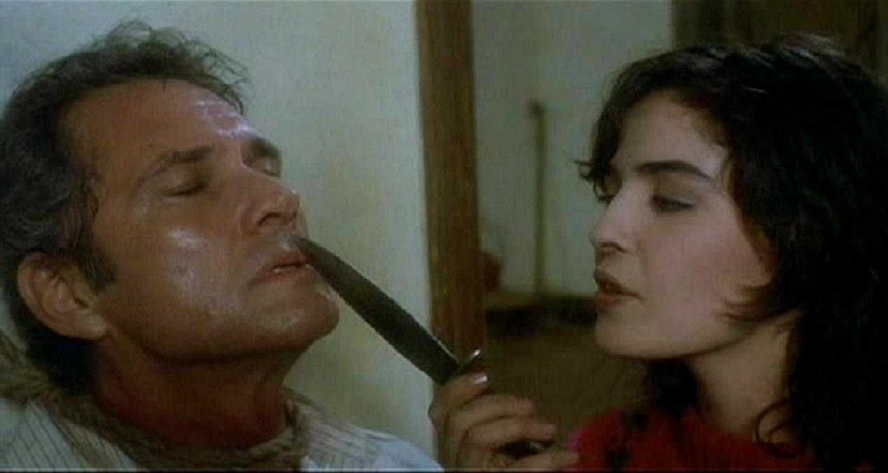 Brett Halsey held as prisoner by Blanca Marsillach in The Devil's Honey (1986)