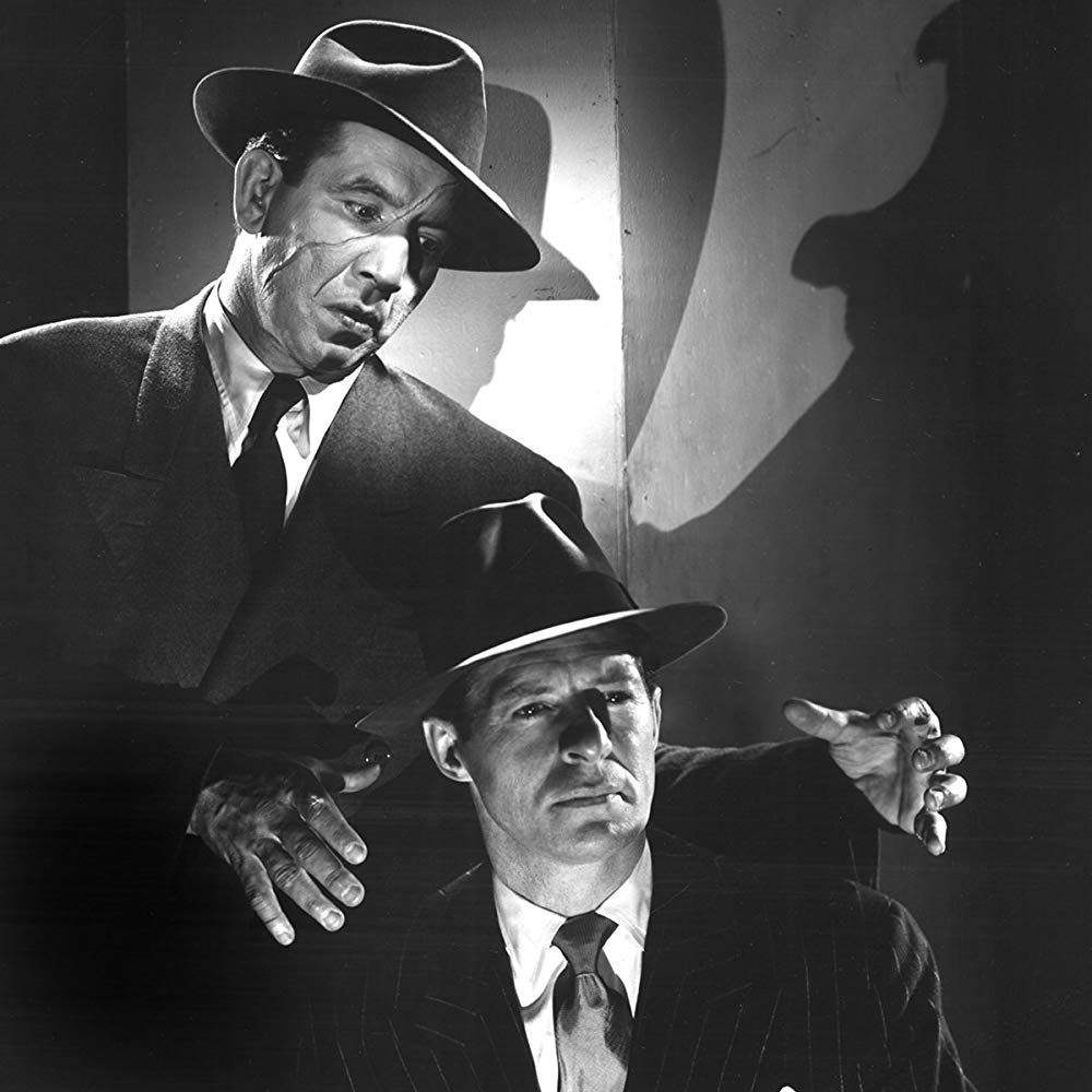 Dick Tracy (Morgan Conway) (bottom) menaced by Splitface (Mike Mazurki) (top) in Dick Tracy (1945)