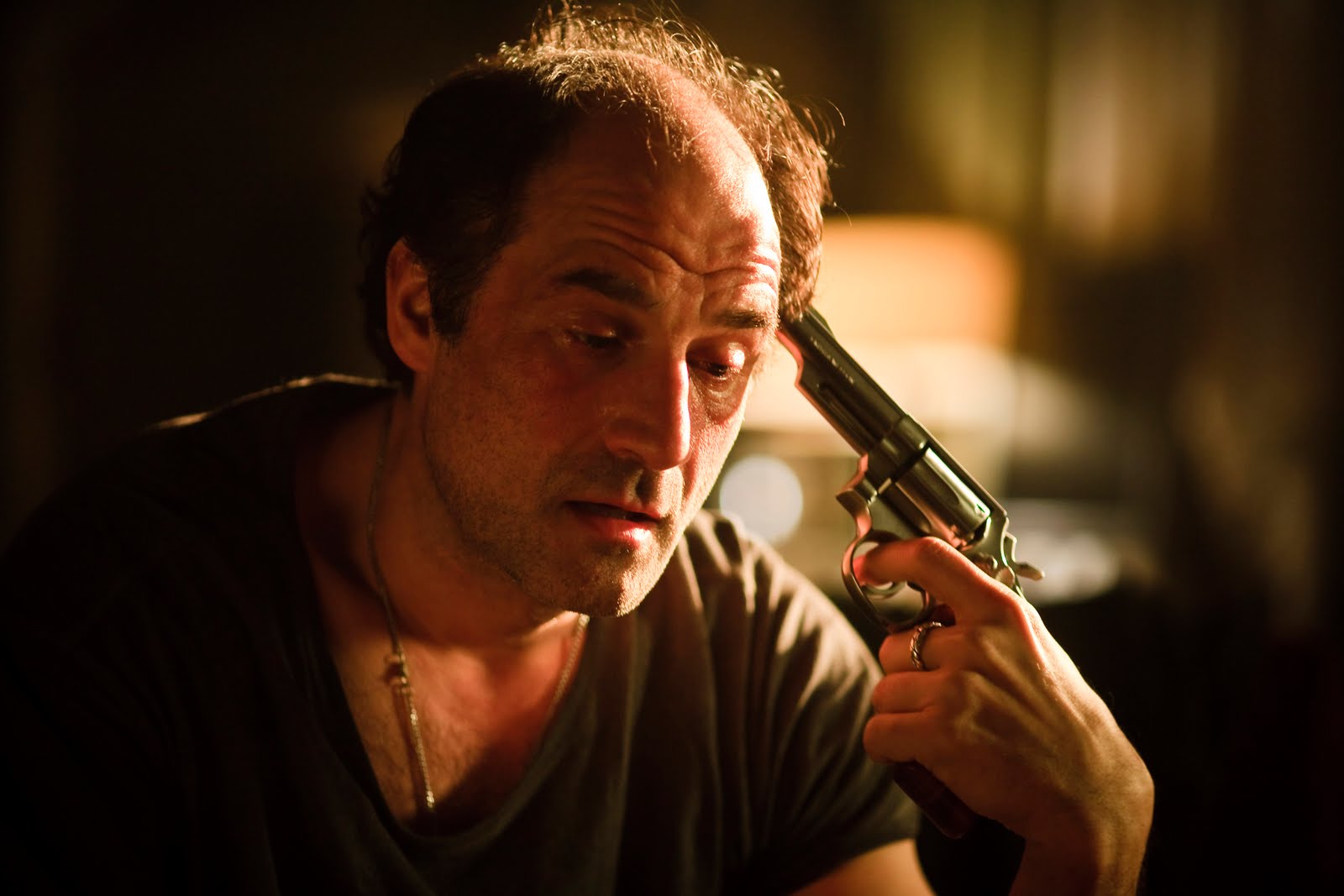 Detective Elias Koteas engages in a game of Russian Roulette in Die (2010)