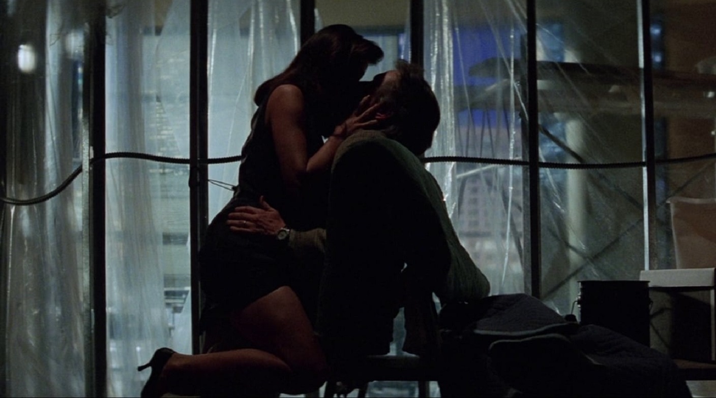 Demi Moore, Michael Douglas in steamy workplace embrace in Disclosure (1994)