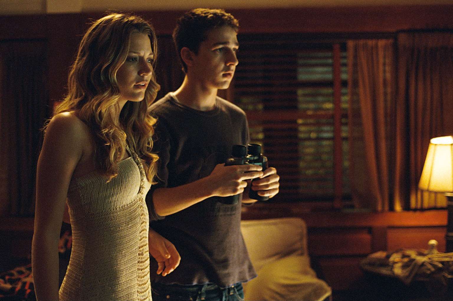 Shia LaBeouf and Sarah Roemer spy on the neighbourhood with binoculars in Disturbia (2007)