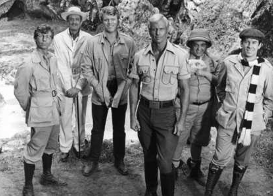 Doc Savage and the Brain Trust - (l to r) Johnny Littlejohn (Eldon quick), Ham Brooks (Darrell Zwerling), Renny Renwick (William Lucking), Doc Savage (Ron Ely), Monk Mayfair (Michael Miller) and Long Tom Roberts (Paul Gleason) in Doc Savage –The Man of Bronze (1975)