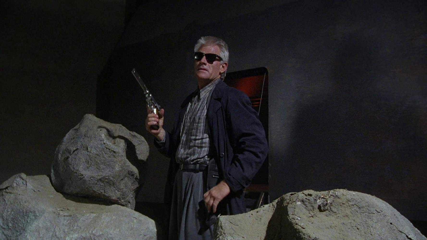 Tim Thomerson as miniature alien cop Brick Bardo in Dollman (1990)