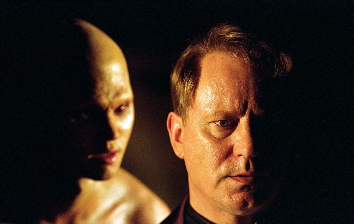 Father Merrin (Stellan Skarsgård) taunted by demonic forces in Dominion: Prequel to The Exorcist (2005)