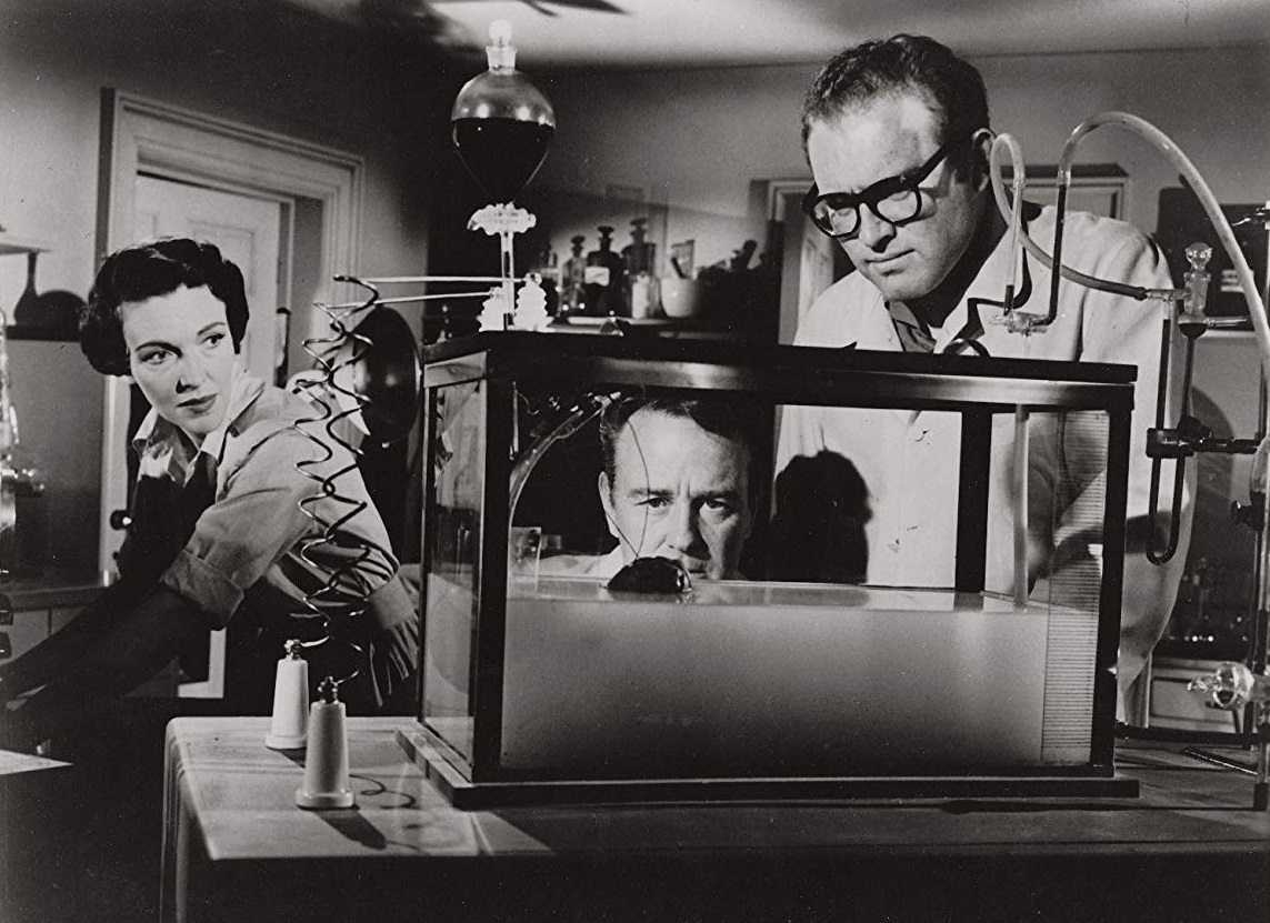 Nancy Davis (late Nancy Reagan), Lew Ayres and Gene Evans view Domovan's Brain in the tank