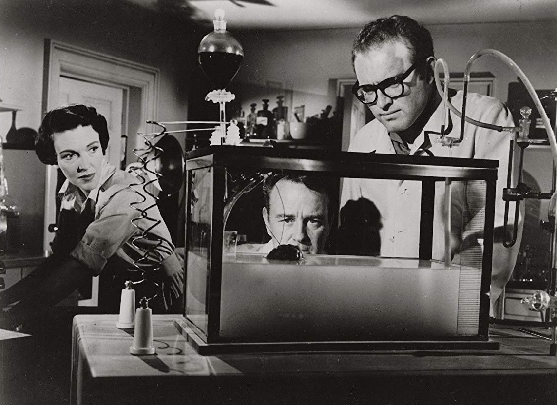 Nancy Davis (late Nancy Reagan), Lew Ayres and Gene Evans view Domovan's Brain in the tank