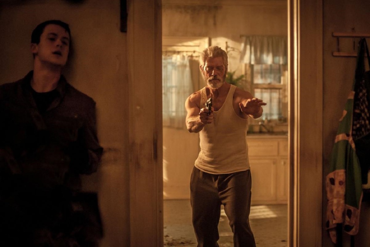 Dylan Minette hides from The Blind Man (Stephen Lang) in Don't Breathe (2016)