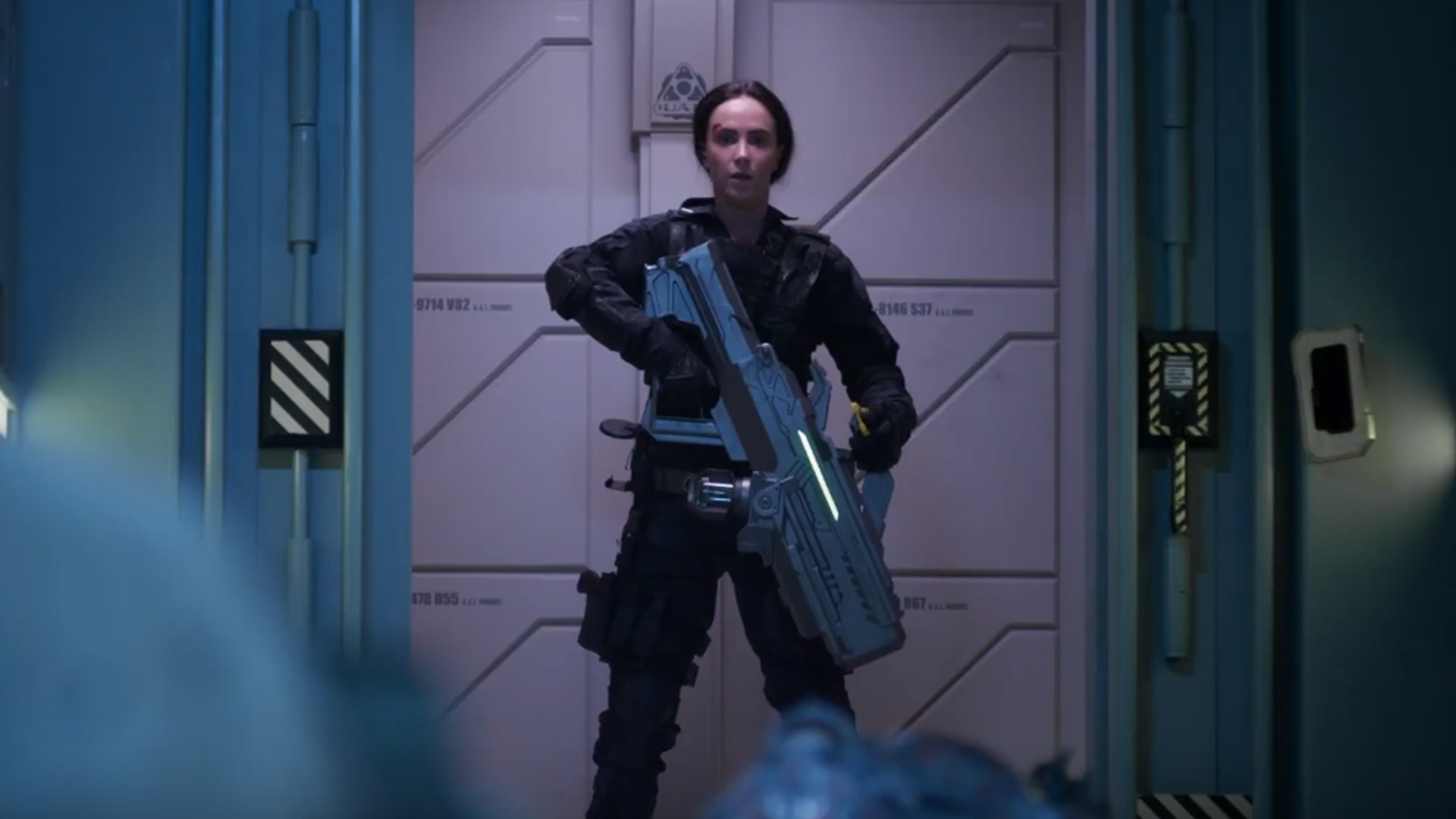 Lieutenant Joan Dark (Amy Manson) goes into action with the BFG in Doom: Annihilation (2019)