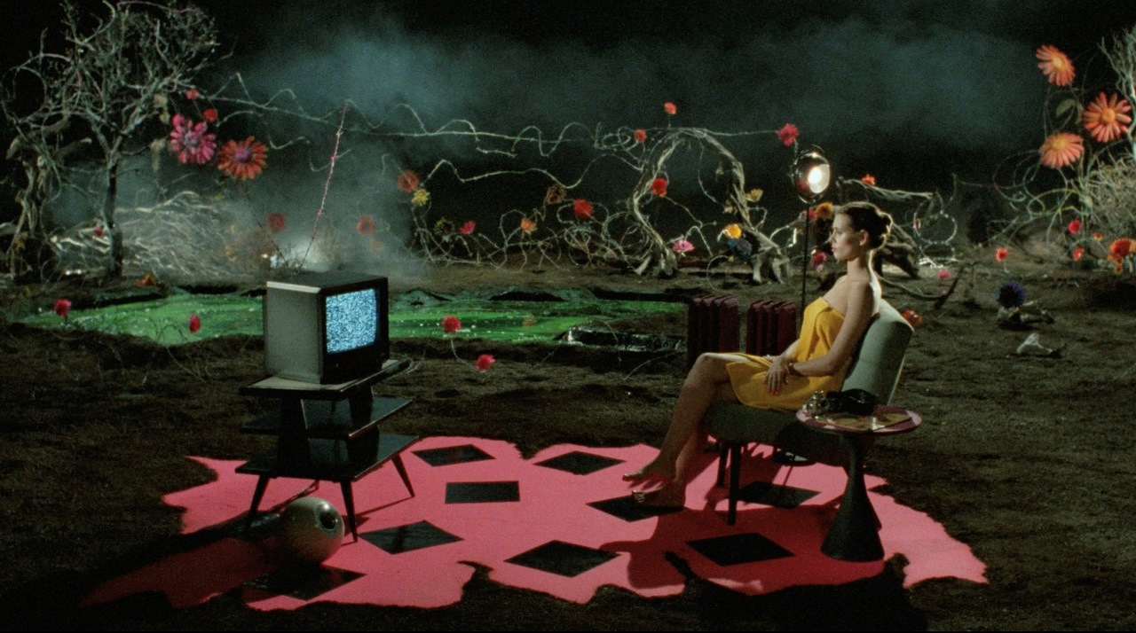 The surrealist sets for the asylum in Dr Caligari (1989). With Laura Albert seated.