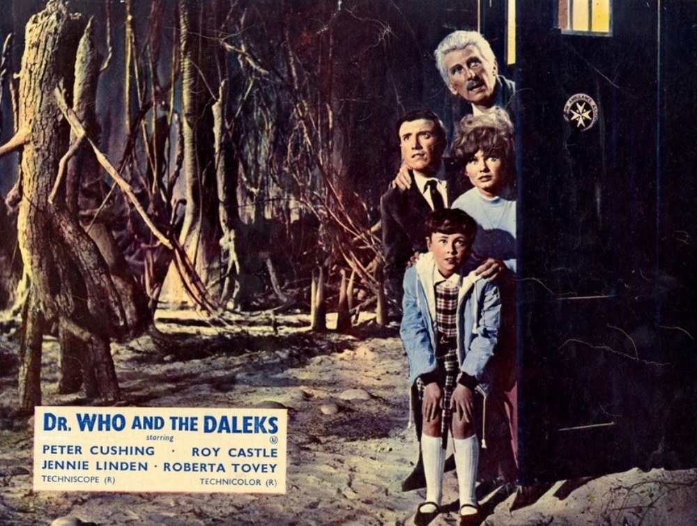 The travellers emerge from the Tardis in the petrified forest on Skaro - (top to bottom) Doctor Who (Peter Cushing), Ian (Roy Castle), Barbara (Jennie Linden) and Susan (Roberta Tovey) in Dr Who and the Daleks (1965)