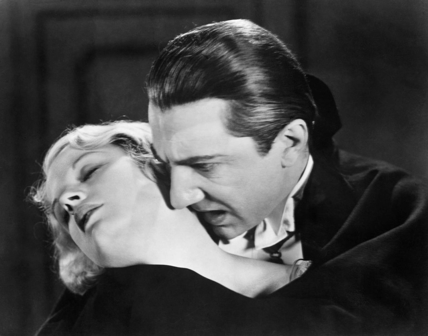 Bela Lugosi sinks his teeth into Helen Chandler's neck in Dracula (1931)