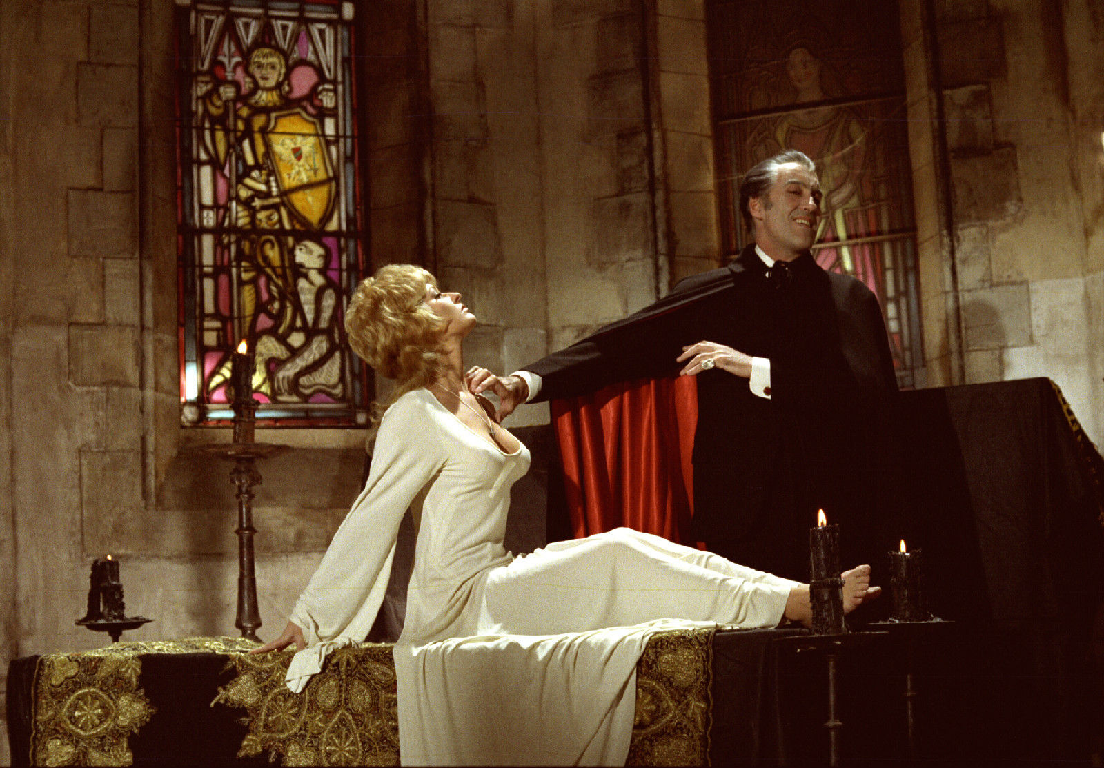 Dracula (Christopher Lee) tries to sneak a grope of Stephanie Beacham's cleavage in Dracula A.D. 1972 (1972)