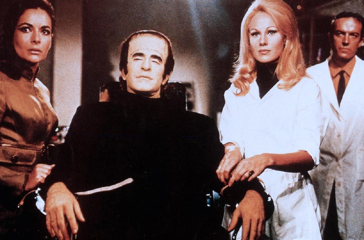 The Frankenstein/Farancksalan Monster (Ferdinando Murolo) (c) and Karin Dor (to the right of him) in Dracula vs. Frankenstein (1970)