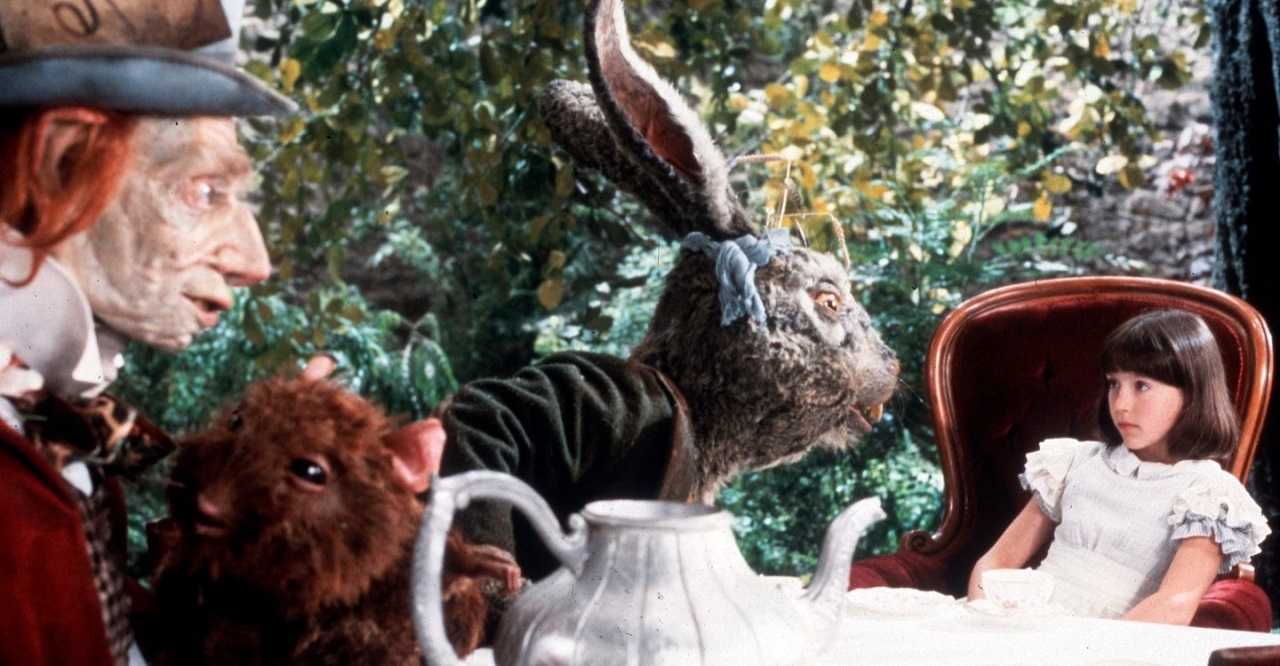 The young Alice (Amelia Shankley) with the Mad Hatter, Dormouse and White Rabbit in Dreamchild (1985)