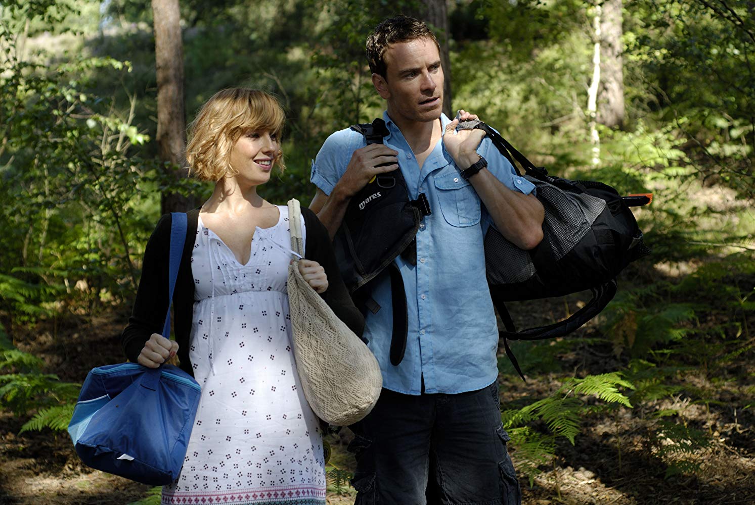 Kelly Reilly and Michael Fassbender as an innocent city couple on a camping trip in Eden Lake (2008)