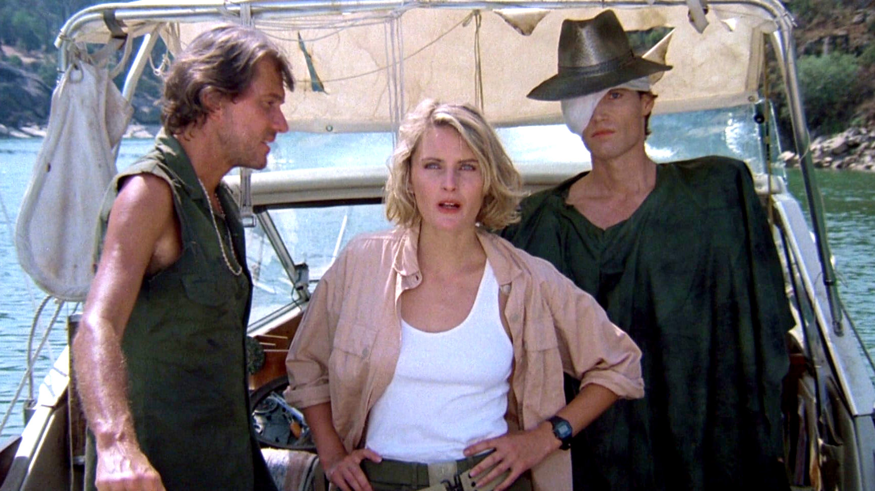 Boat captain Harry Fontana (Andrew Prine), roboticist Nora Hunter (Denise Crosby) and Mandroid (Patrick Reynolds) as the Eliminators (1986)