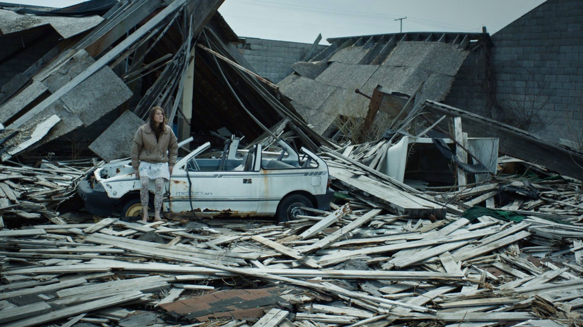 Iva Gocheva stands in the ruins of a house in Embers (2015)