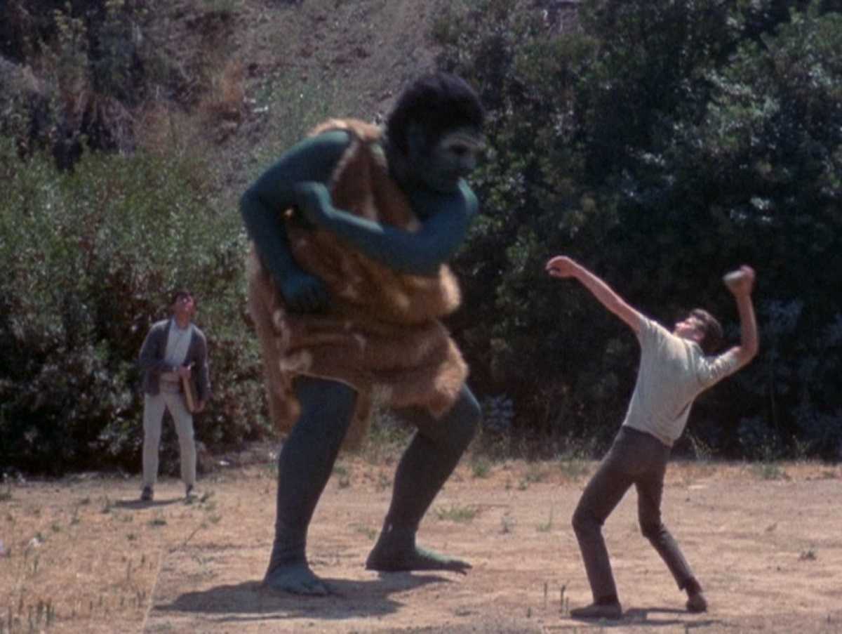 Edward Connell fight off the ape-like demon. With Frank Bonner in the background in Equinox (1970)