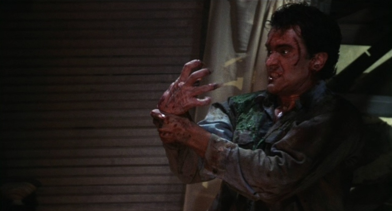 Bruce Campbell fights possessed hand in Evil Dead II (1987)