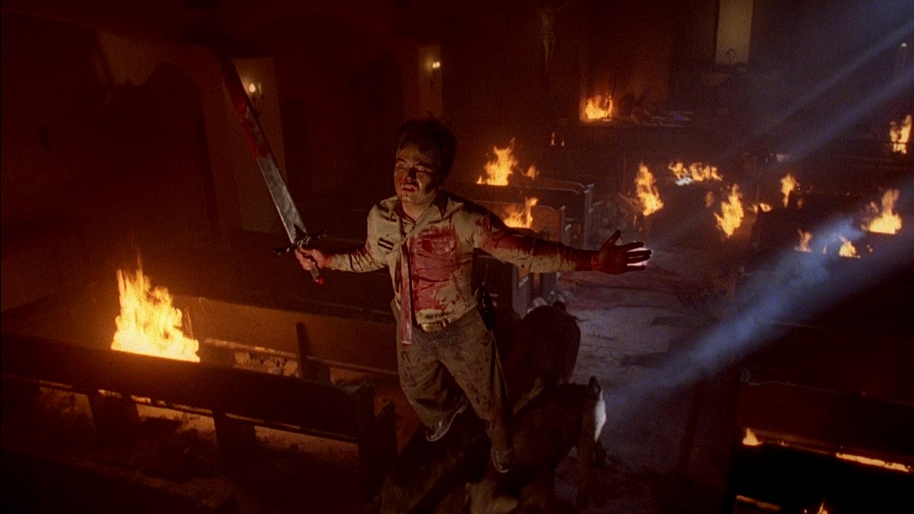 Clint Howard flies through the burning chapel in Evilspeak (1981)