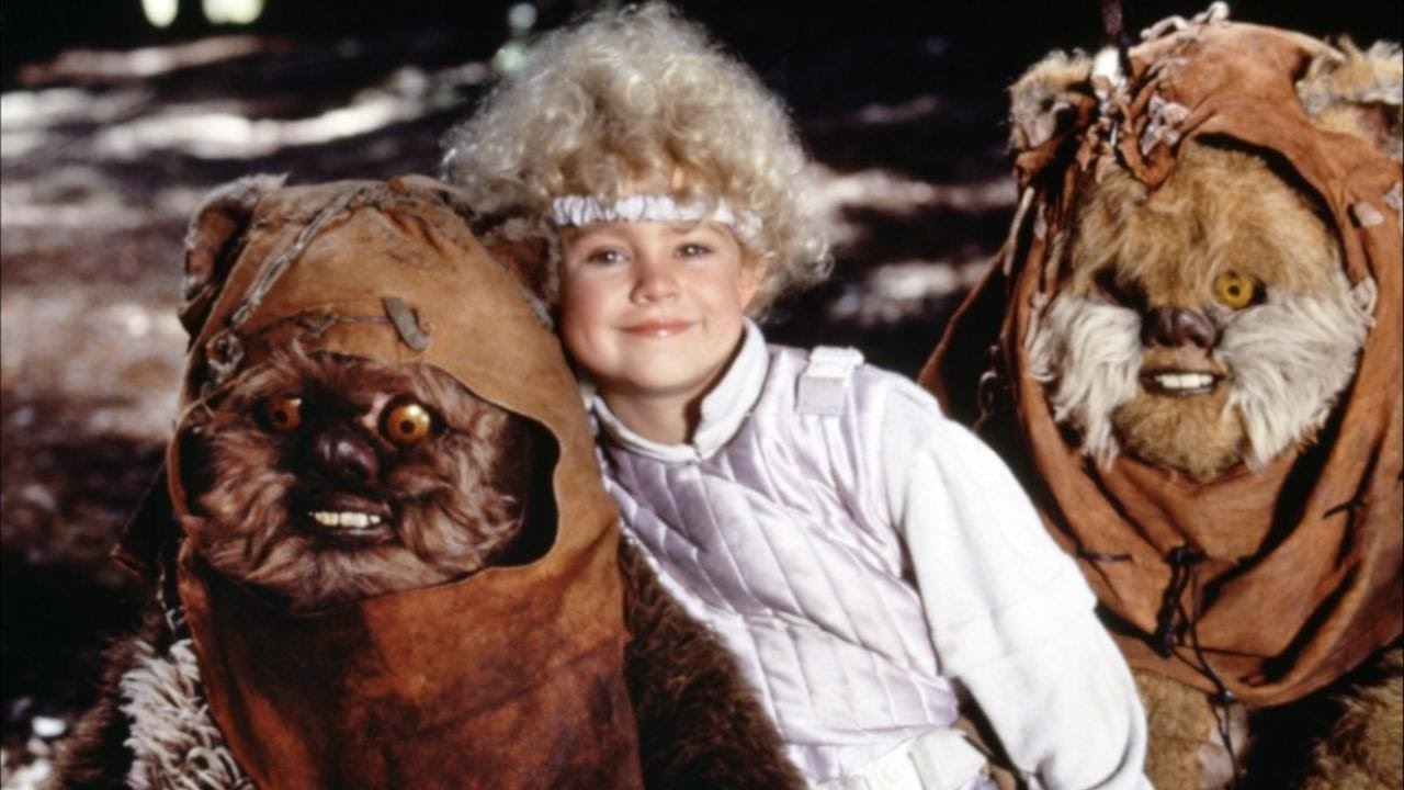 Cindel (Aubree Miller) surrounded by Ewoks in Ewoks and the Marauders of Endor (1986)