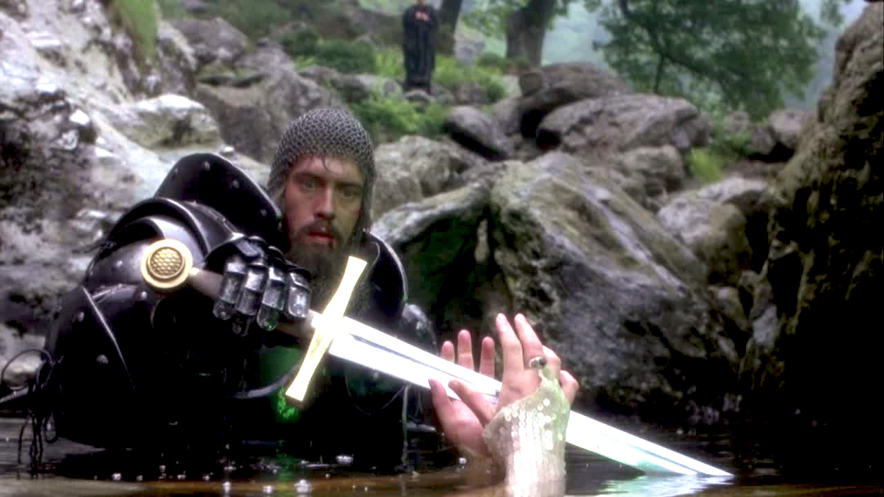 Arthur (Nigel Terry) takes the sword from the Lady of the lake in Excalibur (1981)