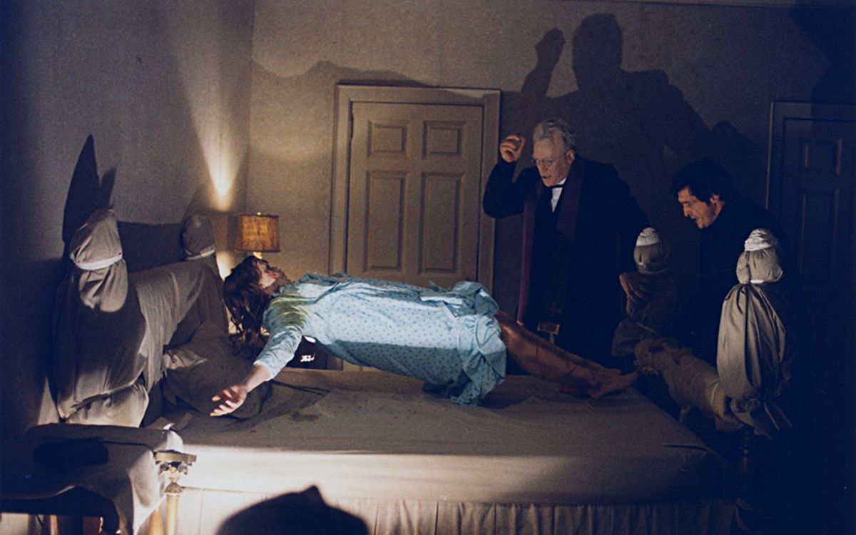 (l to r) Linda Blair in mid-levitation, Father Merrin (Max Von Sydow) and Father Karras (Jason Miller) in The Exorcist (1973)