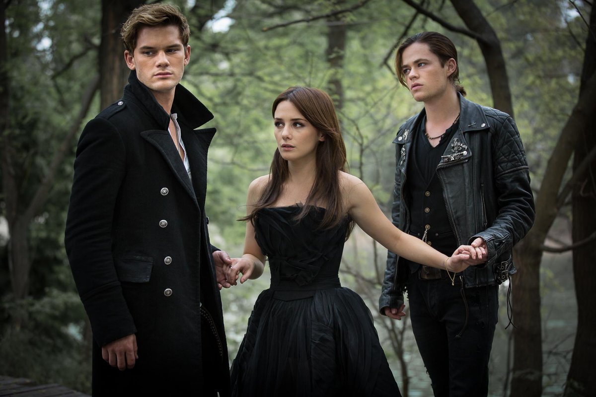 Heroine Lucinda Price (Addison Timlin) surrounded by good angel Daniel Grigori (Jeremy Irvine) and bad boy angel Cam Briel (Harrison Gilbertson) in Fallen (2016)